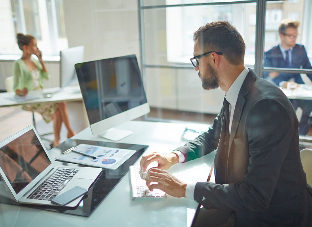 business office with laptop and computer